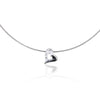 Heart-shaped pendant shown on a silver choker. Shown with shadow.