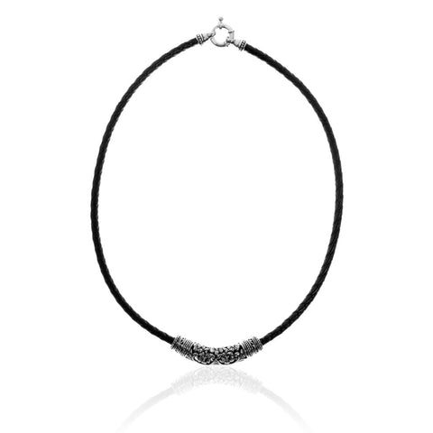 Kelly necklace from ANTIKA, has an intricately carved sterling silver bead on a woven black vinyl choker, 42cm long.