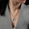 Sterling silver pendant necklace with a double chain. The pendant has a combined half textured matt and half high polish finish. Zahra pendant necklace from Antika. Made in Germany.