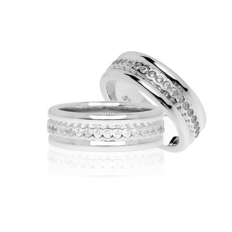 A continuous row of white cubic zirconia stones with moulded sterling silver to mirror the stones, enhances the profile of the Emma ring., 7mm wide.