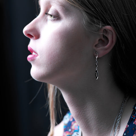 Open, almond-shaped links form a long drop earring in sterling silver, 44mm long. The links are gently concave, ref 7493.