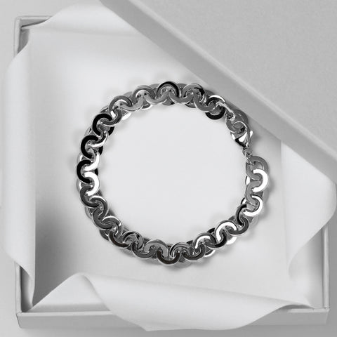 Round, flat links bracelet shown in box.