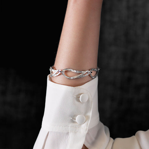 Five textured links bracelet shown on arm of model.