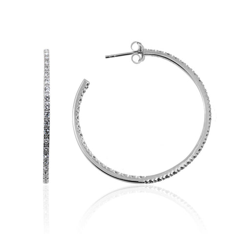 Sterling silver hoop earrings from ANTIKA,  39mm in diameter, with continuous crystals down the front face of the earring that follows down the back of the inside face.