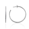 Sterling silver hoop earrings from ANTIKA,  39mm in diameter, with continuous crystals down the front face of the earring that follows down the back of the inside face.