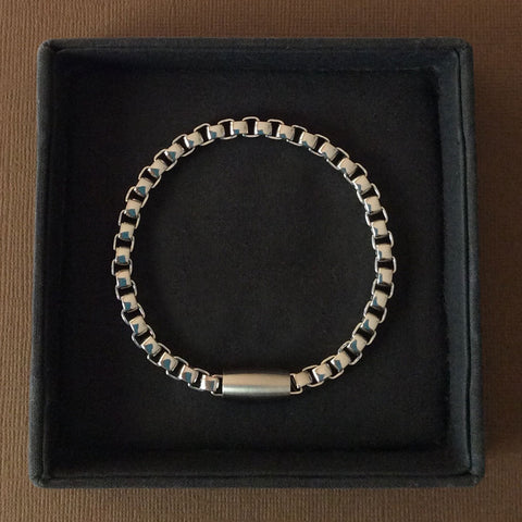 Mens stainless steel bracelet 21cm long with interlocking, curved square links 5mm wide in contemporary design with a magnetic feature clasp.