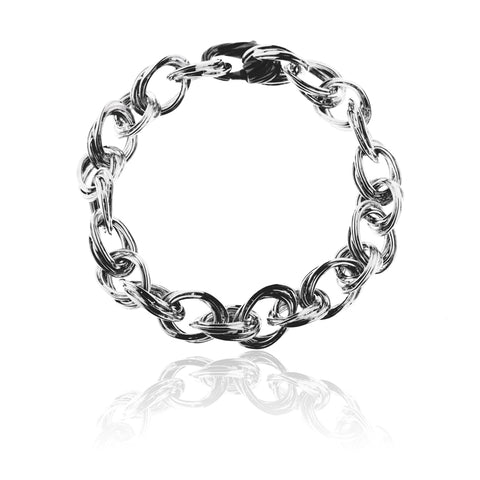 Juana Bracelet from Antika with textured  links of white sterling silver with black sterling silver feature clasp.  19cm long and  links 13.5mm  x 9mm.  Lobster closure in black rhodium in a textured design to match the links  Weight approximately 20 grams.