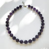 Round amethyst stones with glass beads spacers. 40cm long with 5.5cm Sterling Silver extension chain and clasp.