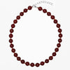 Round dark carnelian stones with glass bead spacers and a sterling silver chain and clasp, by ANTIKA.